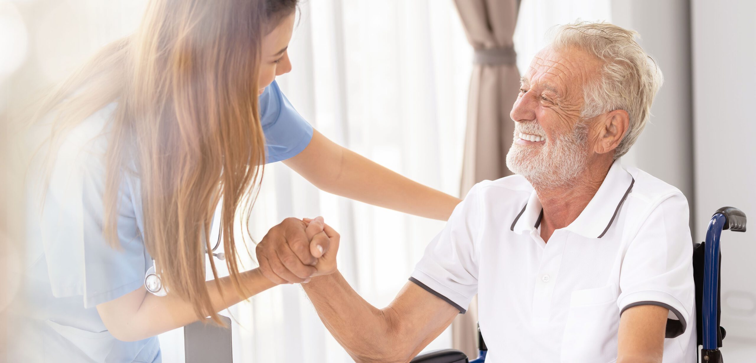 Web banner Man being cared for by a private Asian nurse at home suffering from Alzheimer's disease to closely care for elderly patients with copy space on left